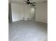 Open living room featuring new flooring and a modern ceiling fan at 4502 N 50Th Ave, Phoenix, AZ 85031