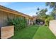 A well-manicured backyard with lush grass, and privacy fencing at 4525 N 66Th St # 1, Scottsdale, AZ 85251