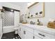 Well-lit bathroom featuring modern fixtures, decorative tiles, and a white vanity at 4525 N 66Th St # 1, Scottsdale, AZ 85251