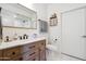 Bathroom featuring a wooden vanity, a large mirror, and a walk-in glass shower at 4525 N 66Th St # 1, Scottsdale, AZ 85251