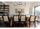 Elegant dining room featuring a large wooden table and modern black dining chairs at 4525 N 66Th St # 1, Scottsdale, AZ 85251