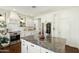 Open kitchen with a marble countertop island, stainless steel appliances, and white cabinets providing ample storage space at 4525 N 66Th St # 1, Scottsdale, AZ 85251