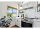 Well-lit kitchen featuring stainless steel appliances, white cabinets, marble countertops, and stylish decor accents at 4525 N 66Th St # 1, Scottsdale, AZ 85251