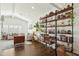 Bright living room with a large sectional sofa, home office, and custom shelving at 4525 N 66Th St # 1, Scottsdale, AZ 85251