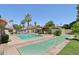 Community pool featuring a shuffleboard, poolside seating and mature trees at 4525 N 66Th St # 1, Scottsdale, AZ 85251