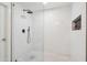 Modern walk-in shower featuring white mosaic tile and a black rainfall shower head at 4525 N 66Th St # 1, Scottsdale, AZ 85251