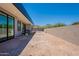 Modern backyard with sliding glass doors, wall and space to add a custom yard at 5145 N Ascent Dr, Scottsdale, AZ 85251