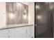 Modern bathroom featuring gray tile backsplash, vanity with white cabinets, and door to hall at 5145 N Ascent Dr, Scottsdale, AZ 85251