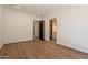 Open bedroom featuring hardwood floors, closet, and ensuite bathroom at 5145 N Ascent Dr, Scottsdale, AZ 85251