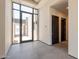 Bright, airy foyer with floor-to-ceiling windows and dark doors at 5145 N Ascent Dr, Scottsdale, AZ 85251