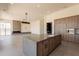 Open-concept kitchen and living room featuring a large island, custom cabinetry, and modern appliances at 5145 N Ascent Dr, Scottsdale, AZ 85251