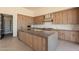 Gourmet kitchen with a large center island, custom cabinetry, and high-end stainless steel appliances at 5145 N Ascent Dr, Scottsdale, AZ 85251