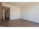 Bright living room features beautiful hardwood flooring and view to hallway at 5145 N Ascent Dr, Scottsdale, AZ 85251