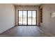 Bright living room with wood floors and sliding glass doors to bring the outdoors in at 5145 N Ascent Dr, Scottsdale, AZ 85251