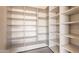 Pantry showcases ample shelving for optimal storage and organization; perfect for any homeowner at 5145 N Ascent Dr, Scottsdale, AZ 85251