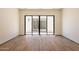 Room with wood flooring and large sliding glass doors leading to the outdoor patio at 5145 N Ascent Dr, Scottsdale, AZ 85251