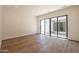 Room with wood flooring and large sliding glass doors leading to the outdoor patio at 5145 N Ascent Dr, Scottsdale, AZ 85251