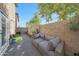 Paver patio area with comfortable outdoor seating, a brick wall, and string lights at 5439 W Odeum Ln, Phoenix, AZ 85043