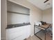 Bedroom featuring neutral walls, a built-in closet, and wood look flooring at 5439 W Odeum Ln, Phoenix, AZ 85043