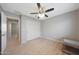 Bright bedroom featuring wood floors, a closet, and a ceiling fan for enhanced comfort at 5439 W Odeum Ln, Phoenix, AZ 85043