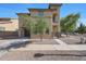 Two-story home with desert landscaping and a private two-car garage at 5439 W Odeum Ln, Phoenix, AZ 85043