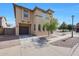 Two-story home with a private two-car garage, gravel landscaping, and a tile roof at 5439 W Odeum Ln, Phoenix, AZ 85043