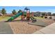 Community playground with colorful play structure, slides, and climbing features for enjoyment at 5439 W Odeum Ln, Phoenix, AZ 85043