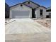 A single story white house with an attached garage is under construction at 6022 E Artemis Dr, Florence, AZ 85132