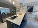 Modern kitchen with stainless steel appliances, eat-in island, and sleek design at 7120 E Kierland Blvd # 404, Scottsdale, AZ 85254