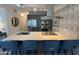 Modern kitchen with stainless steel appliances, eat-in island, and granite countertops at 7120 E Kierland Blvd # 404, Scottsdale, AZ 85254