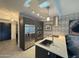 The living area showcases the modern kitchen, with stainless steel appliances and island seating at 7120 E Kierland Blvd # 404, Scottsdale, AZ 85254