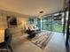Modern living room featuring floor-to-ceiling windows and contemporary decor at 7120 E Kierland Blvd # 404, Scottsdale, AZ 85254