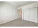 Bedroom featuring neutral carpet, closet, and ensuite at 7575 E Indian Bend Rd # 1005, Scottsdale, AZ 85250