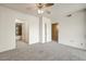 Spacious bedroom with neutral walls and doors to the ensuite bathroom and hallway at 7575 E Indian Bend Rd # 1005, Scottsdale, AZ 85250