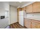Kitchen with wood-look flooring, oak cabinets, and white countertops at 7575 E Indian Bend Rd # 1005, Scottsdale, AZ 85250