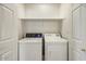 Laundry room featuring a white washer and dryer and wire shelving at 7575 E Indian Bend Rd # 1005, Scottsdale, AZ 85250