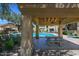 A community pool and covered seating area with a picnic table at 7575 E Indian Bend Rd # 1005, Scottsdale, AZ 85250