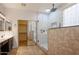 Modern bathroom featuring a walk-in shower and convenient access to the walk-in closet at 760 N Swallow Ln, Gilbert, AZ 85234