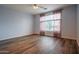 Light and bright bedroom features a ceiling fan and wood-look floors at 760 N Swallow Ln, Gilbert, AZ 85234