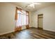 Empty bedroom featuring wood-look floors, a closet, and neutral paint at 760 N Swallow Ln, Gilbert, AZ 85234