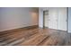 Vacant bedroom showcases wood-look floors and large closet at 760 N Swallow Ln, Gilbert, AZ 85234