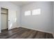 Neutral bedroom featuring wood-look floors and a closet at 760 N Swallow Ln, Gilbert, AZ 85234