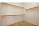Walk-in closet offering ample storage space with built in shelving at 760 N Swallow Ln, Gilbert, AZ 85234