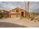 Inviting stucco home with desert landscaping and a three-car garage at 760 N Swallow Ln, Gilbert, AZ 85234