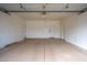 A well-lit, spacious garage with an epoxy floor coating at 760 N Swallow Ln, Gilbert, AZ 85234