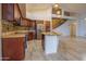 Open kitchen featuring wooden cabinets, granite counters and a large island at 760 N Swallow Ln, Gilbert, AZ 85234