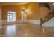 Bright and airy living room with a large window and wainscotting at 760 N Swallow Ln, Gilbert, AZ 85234