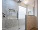 A contemporary glass walk-in shower with rainfall shower head and stylish tile at 760 N Swallow Ln, Gilbert, AZ 85234
