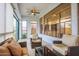 Cozy sunroom with comfortable seating, a ceiling fan, and lots of natural light at 760 N Swallow Ln, Gilbert, AZ 85234