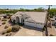 Bird's eye view of this home showcasing its tile roof, desert landscaping, and three-car garage at 804 N 46Th St, Mesa, AZ 85205